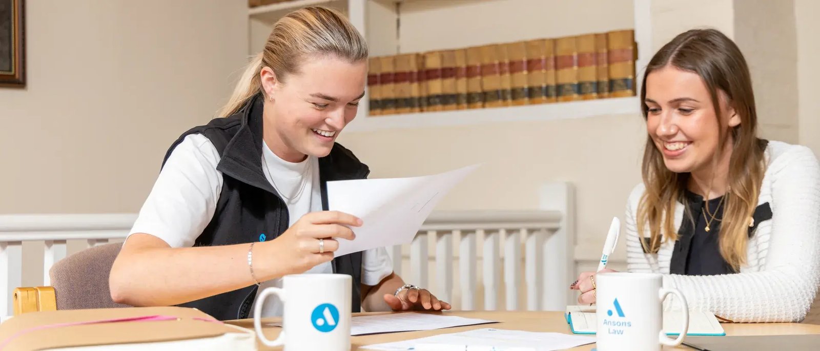 Going through papers at the round table in the Ansons Law office in Lichfield
