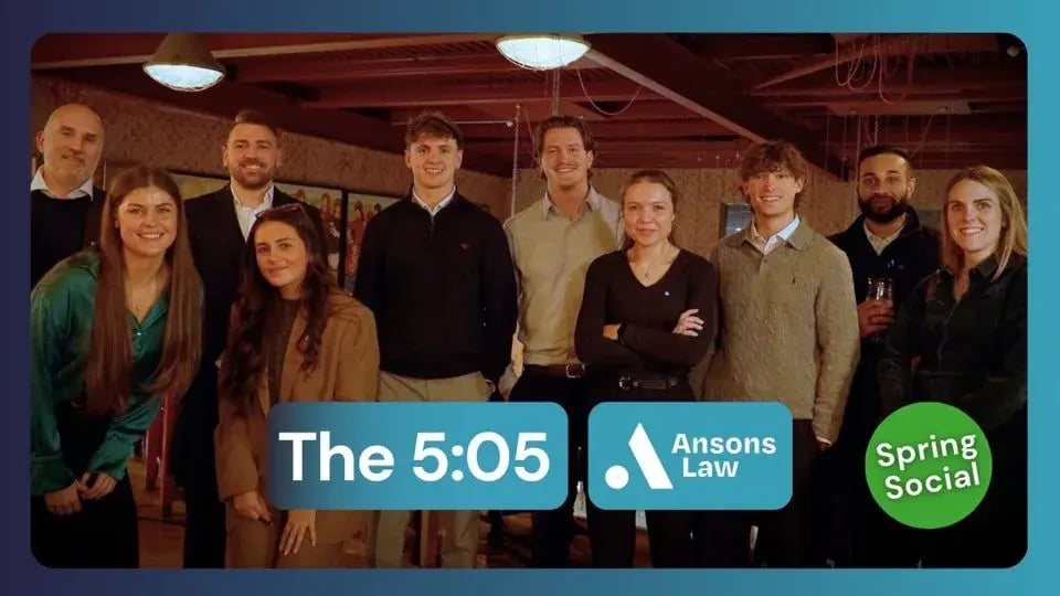 A group of young professionals smiling together at the 5:05 Spring Social 2026