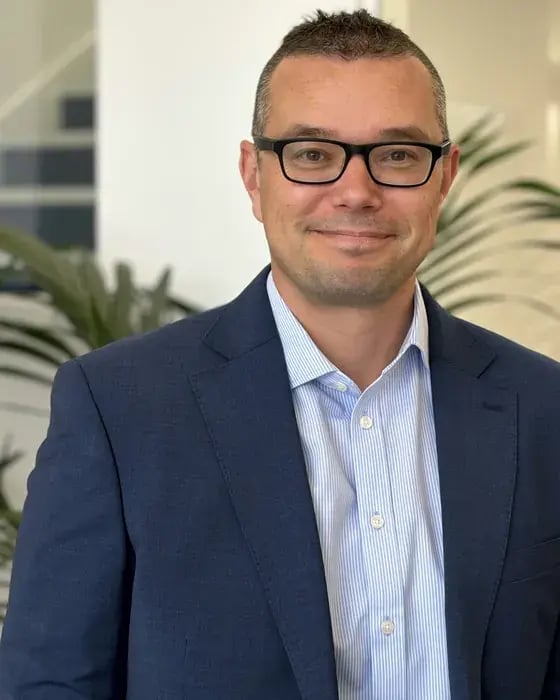 Adrian Schuck, Associate Director